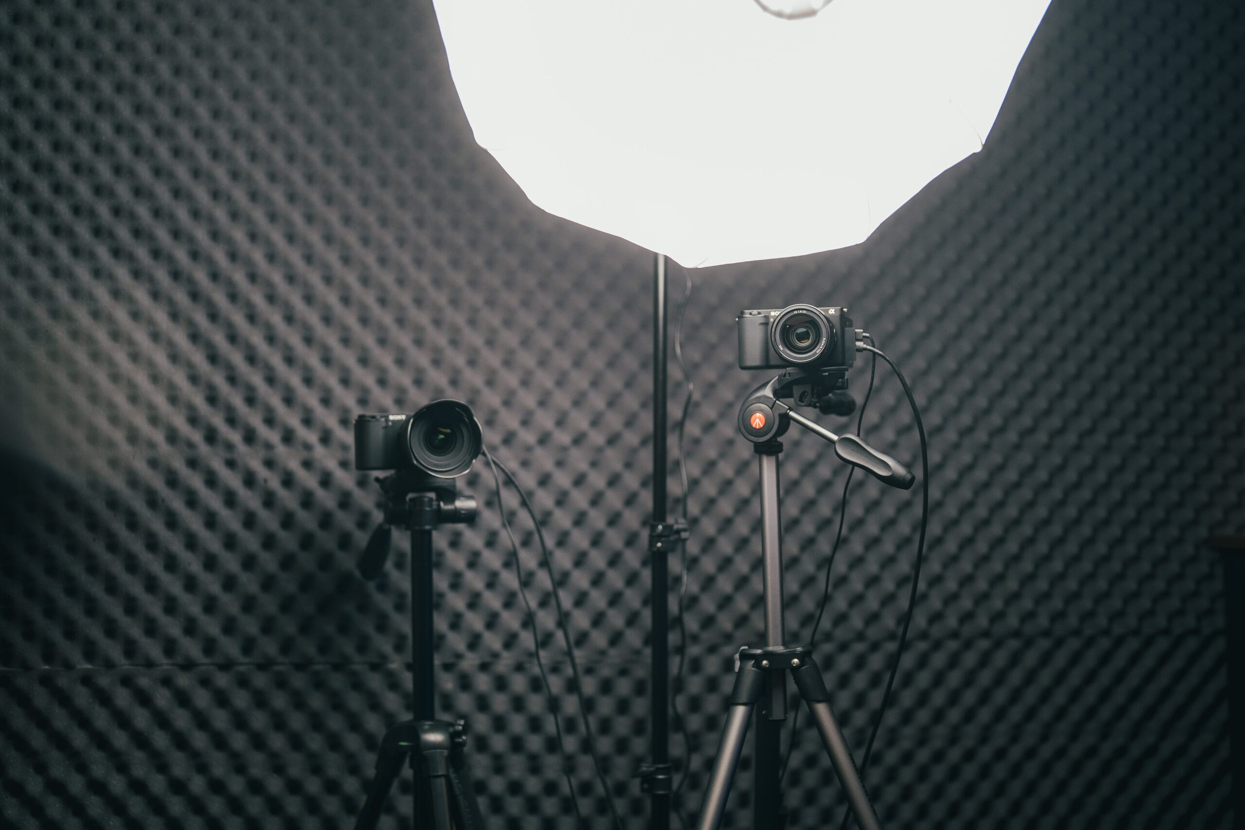 Multiple Sony cameras in the studio with a Neewer light lantern.